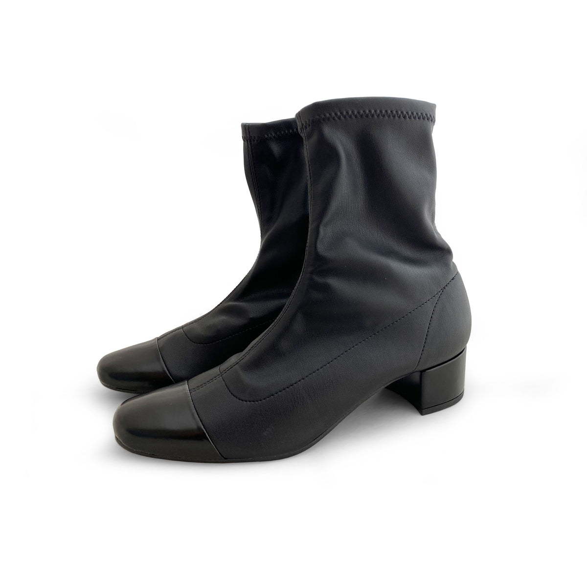 Stivaletti neri a calza in similpelle elasticizzata e punta in pelle nera