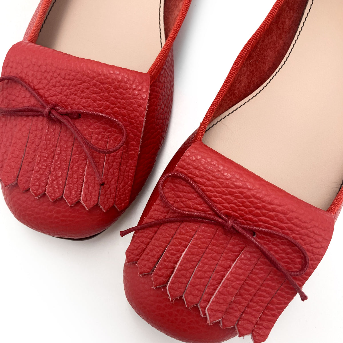 Mocasines de mujer rojos de piel con flecos